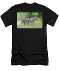 Two Coyotes Standing Close Together in a Grassy Natural Setting Yuval Helfman T-Shirt